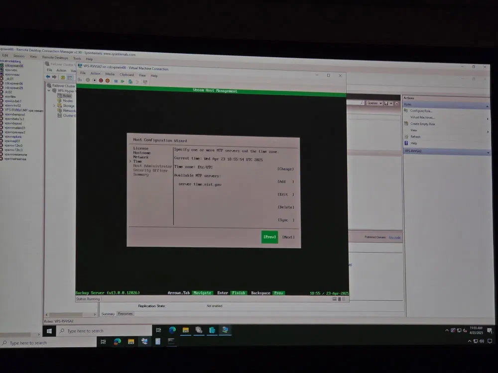 A projector displays the Veeam Backup & Replication console with a Host Configuration Wizard open, showing settings for time synchronization including current time and NTP servers.
