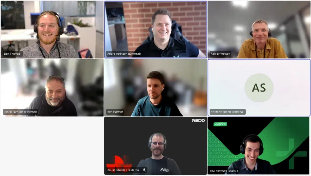 Nine people in a grid-style video call. Participants include Ben Thomas, Andre Atkinson, Ashley Watson, Justin Farrugia, Ben Harmer, Anthony Spiteri, Keiran Shelden, and Rhys Hammond. Veeam and Redd logos are visible. This is a call of the ANZ Veeam 100 & Friends community.